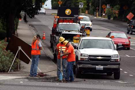 Construction crews prepare N.E. 124th Street at 100th Ave. N.E. for their repaving project.