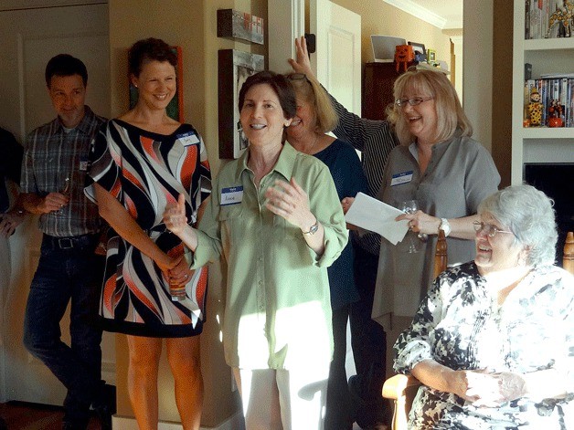 Anne Levinson (center) of the group Washington United for Marriage speaks to a group of more than 100 during an event to raise awareness about marriage equality at Mayor Joan McBride’s Kirkland home on May 26. Also pictured is Council members Amy Walen (second from left)