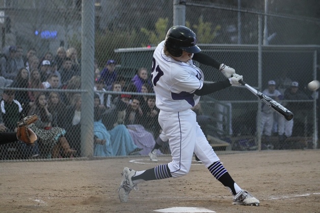 Karsen Rogers of Lake Washington swings for a first-inning hit against Mercer Island April 4 at Lee Johnson Field.