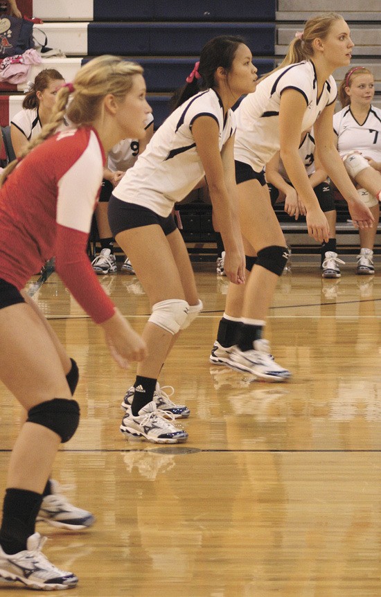 Members of the Juanita volleyball team prepare for a serve during a conference match earlier in the season. The team enters the KingCo tournament this Friday and Saturday at Sammamish High School.