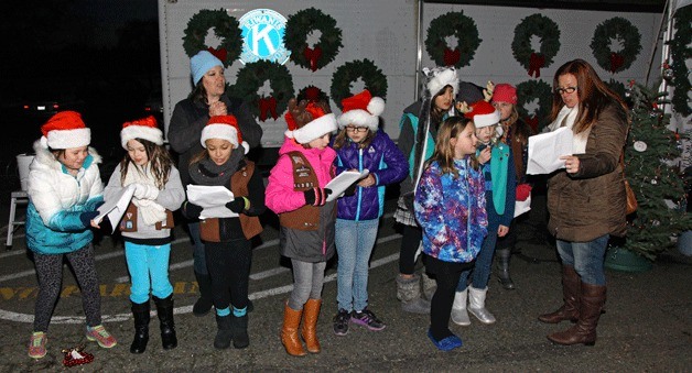 Girl Scouts sing Christmas Carols at the 2014 Kiwanis Club of Kirkland tree lot.