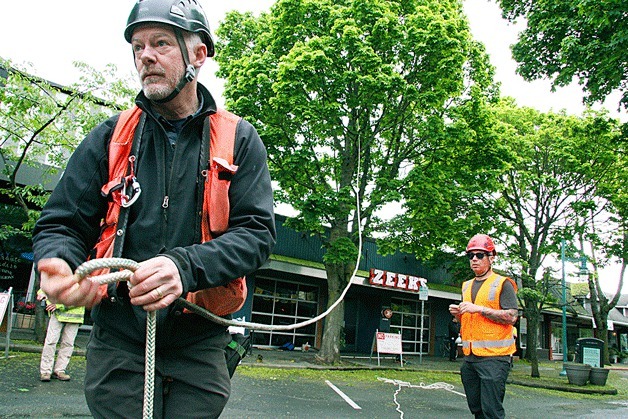 Kirkland’s consulting arborist Scott Baker prepares a rope for a tree test he conducted in May 2014. Kirkland’s contractor