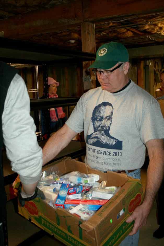 More than 20 volunteers with United Way helped organize the donation storage room at the new Friends of Youth building in Kirkland on Martin Luther King Jr. Day.