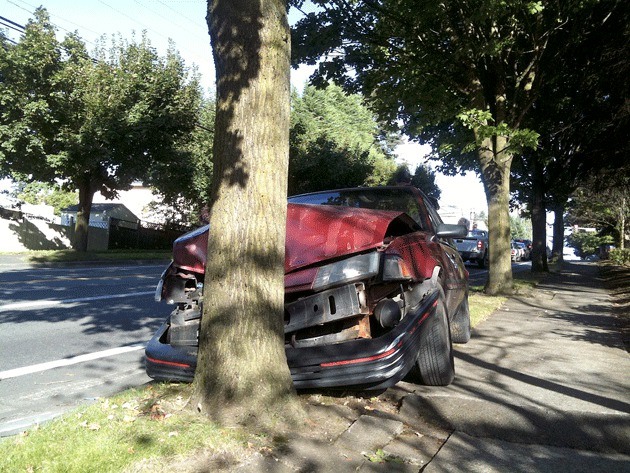 Kirkland Police are searching for the driver who drove his car west along N.E. 132nd St. when the car lost control and swerved left across traffic. The car knocked out a traffic sign before hitting a tree head on. The driver fled on foot.