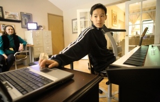 Kirkland's Oliver Hu composing music at his home in the Bridle Trails neighborhood.