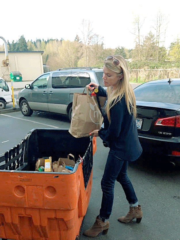 A member of the Xtreme Consulting Group from Kirkland drops off food donations to Hopelink for Can Madness.