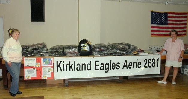 Kirkland Eagles Aerie 2681 show off the organization's school supplies it donated to local schools.