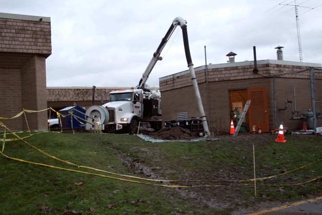 Workers clean up an oil spill at Kamiakin Middle School that occurred Dec. 4. Department of Ecology officials say the incident is still under investigation.