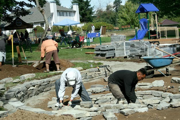 Dozens of residents volunteered at 132nd Square Park Sept. 15-18 to help create a gathering place at the park. The project including building a new covered picnic shelter