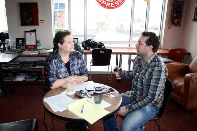 Great Ideas discussion group organizer Margit Moore speaks with fellow member Jeff Wheeler. Great Ideas is a group centered around conversation and meets monthly at the Kirkland St. James Espresso. Topics range from love and courage to science and religion.