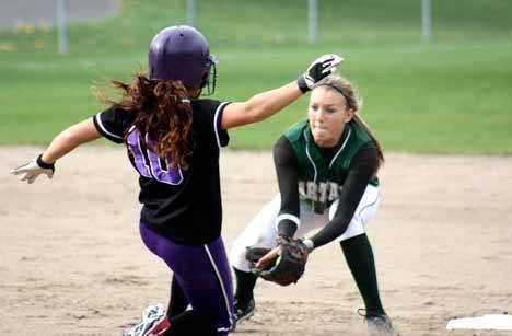 Lindsey Nicholson of Skyline tags out Haley Andrews of Lake Washington as she attempts to steal second base.