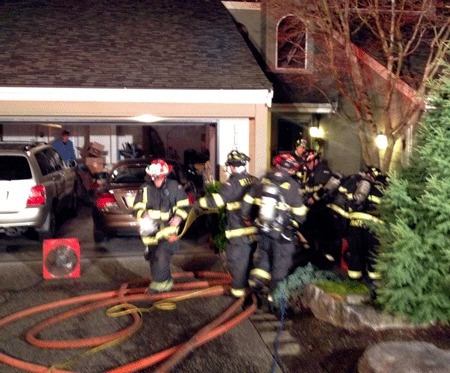 Kirkland firefighters respond to a Houghton townhouse fire Monday night.