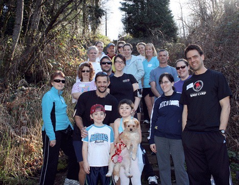 X Gym owner P.J. Glassey (far right) stands with other gym members and their family and friends at the bottom of the Forbes Creek stairway Sunday. The group used the stairs to get ready for the Big Climb event to benefit the fight against Leukemia and Lymphoma. The climb on March 21 will include 69 flights of stairs at the Columbia Center in Seattle.