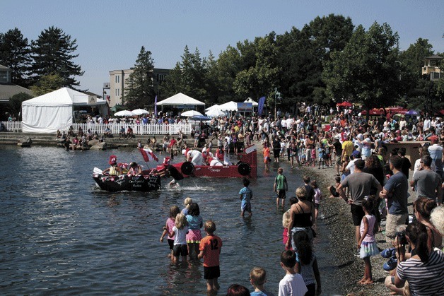 Kirklanders watch as boats are launched during the Moss Bay Cardboard Boat Regatta at last weekend's 2013 Kirkland Summerfest.