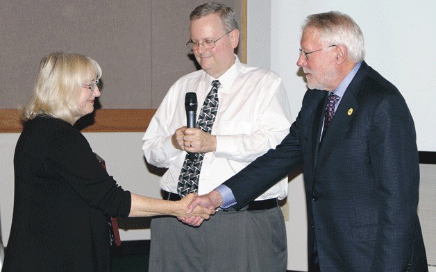 Mayor Joan McBride (left) and Councilman Toby Nixon receive the Key Award from The Washington Coalition for Open Government vice chair Mike Francher.