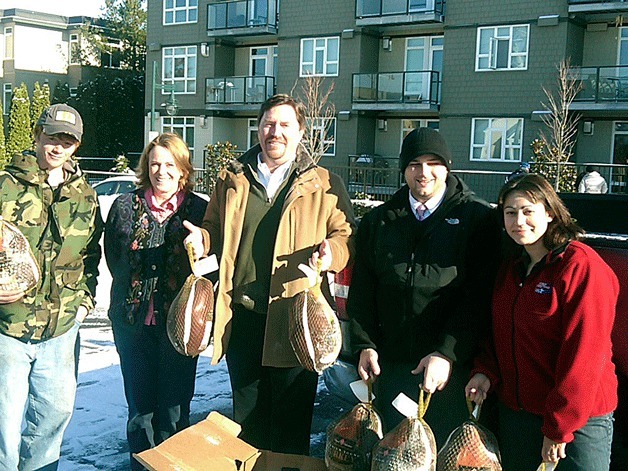 Jim Walen and a few team members from Ford of Kirkland braved the snow and ice to deliver turkey and all the fixings for 20 KITH families on Nov. 23.