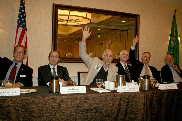 45th and 48th District candidates show their support or opposition for same-sex marriage during a forum on Monday. (From left) Rep. Roger Goodman