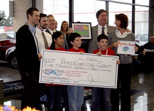 Ford of Kirkland donates a check for $5
