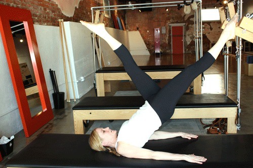 Dana Fykerud demonstrates pilates at her studio