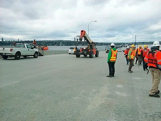 Washington State Department of Transportation workers prepare the new Evergreen Point Floating Bridge for its opening at the beginning of April.
