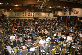 Hundreds of drummers gathered at the Juanita High School Fieldhouse Nov. 2 to join a few thousand drummers internationally via live Internet connection. Together
