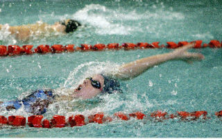 Juanita’s Kelly Tannhauser swims the first leg of the 200 Medley Relay during the KingCo Conference Swim and Dive Championships at Mary Wayte Pool in Mercer Island on Saturday