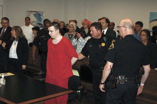 Dakota Wolf is handcuffed after being sentenced 20 years for killing Scarlett Paxton.