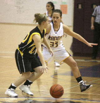 Lake Washington’s Olivia Lewis (No. 33) guards Inglemoor’s Brittany Gardner (No. 10) during the game at Lake Washington High School on Friday