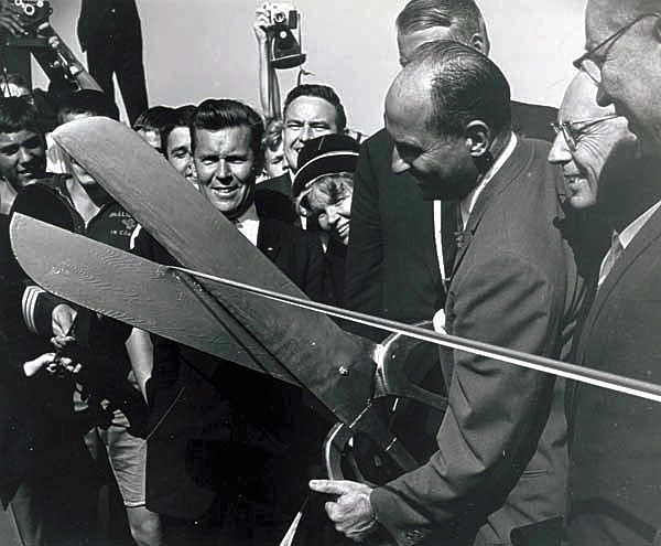 Former Governor Albert D. Rosellini cuts the ribbon at the opening ceremony for the 520 floating bridge.
