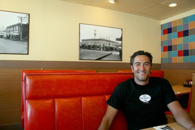 Pete Mangouras sits in the space that formed the original 'George's Place
