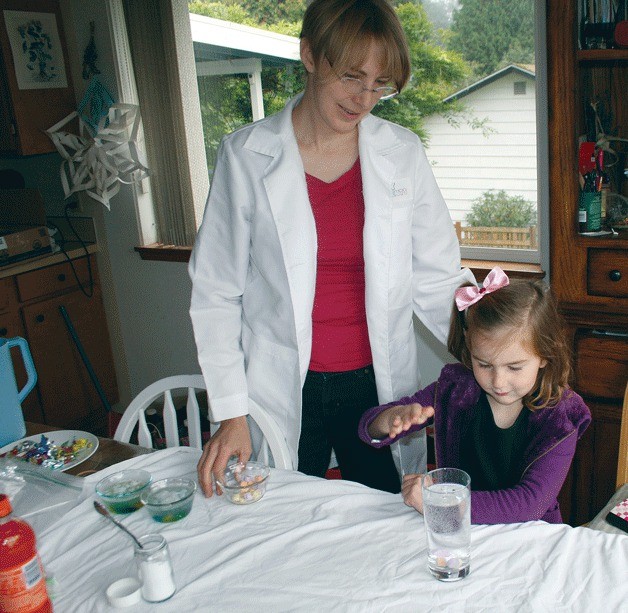 Loralee Leavitt helps her daughter Rebecca