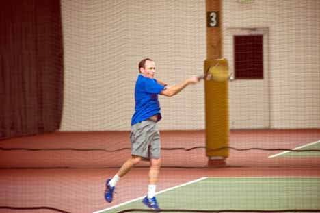 Phil Ansdel strikes a forehand in one of his two finals in the PNW Invitational Tennis Tourney at Central Park Tennis Club in Kirkland Jan. 21-24. Ansdel won the 45’s singles title in three sets over Charl Grobler. In the 35’s singles