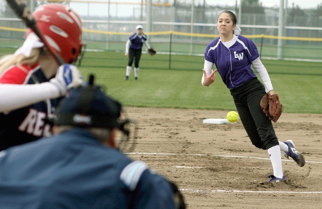 Lake Washington High School softball pitcher Tori Bivens throws a pitch during the team's first ever game at the high school.