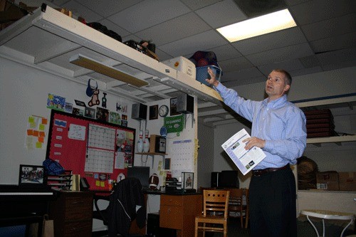 Kirkland Boys and Girls Club Executive Director Doug Wozeniak shows how the small 500-square-foot Teen Center currently is.