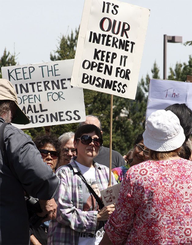 Protesters gather in Kirkland May 15 to protest the FCC's vote to change the rules on net neutrality.