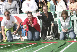 (Inset) Chihuahuas are pushed out of the gate to start one of 28 heats at the second annual “PETCO Unleashed” regional Chihuahua racing championship at the PETCO store in Kirkland last Saturday. From left