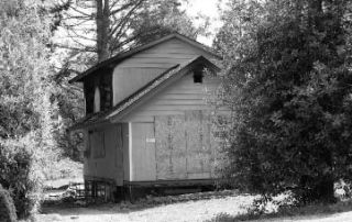 Police arrested two juveniles in connection with an arson fire April 27 in this vacant home in the Rose Hill neighborhood.