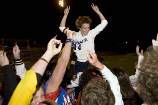 Mark Lowry/Reporter Newspapers Juanita senior Tyler Bjork is carried off the field by the student section after scoring a hat trick in the 4-1 win over Eastlake May 6. Bjork was named the KingCo 4A MVP before the game.