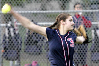 Juanita’s Kylie Sparks (No. 1) winds up to pitch during a KingCo 4A tournament game against Lake Washington at Hartman Park in Redmond May 15.