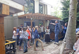 Robert Weber explains to members of the teen group “The Next Generation” the green renovations he and his wife