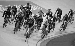 Bike racers jockey for position in the Group Health Velodrome at Marymoor Park May 28. Races at the banked oval track go through Sept. 12.