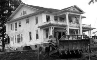 The historic Nettleton Mansion/Green’s Funeral Home was moved by its new owner. See “historic property” brief at right.