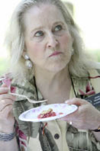 Kirkland City Councilwoman Jessica Greenway looks up and away as she thinks about the granny appleberry pie she’s tasting. Greenway was a judge for a pie making contest at the North Rose Hill Annual Picnic on July 19.