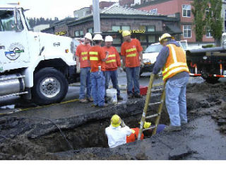 Crews work to repair an eight-inch water main that broke Monday