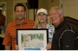 Kirkland Boys & Girls Club Director Doug Wozeniak (left) poses with fundraiser participants during the event.