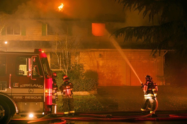 Kirkland firefighters extinguish a house fire in the Evergreen Hill neighborhood on April 24.