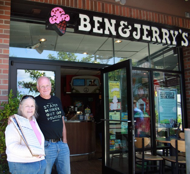 Ben & Jerry’s cofounder Ben Cohen stands with a signature gatherer for I-1329 on Tuesday at the Kirkland store.