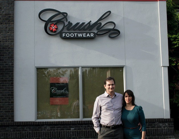 Crush Footwear co-owners Neal Hughes and Rhonda Herbert stand at their old location on Kirkland Avenue. Their new location is on 3 Lake Street near Bella Tesori.