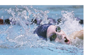 Juanita’s Kelly Tannhauser swims to a win in the 200 freestyle at the 3A state swim meet at the King County Aquatic Center in Federal Way Saturday