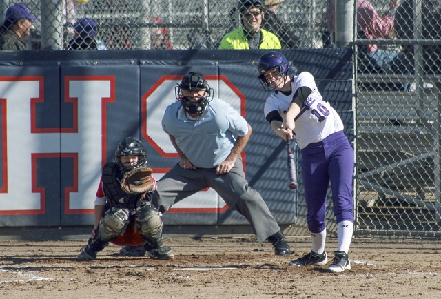 Lake Washington’s Hannah Walker swings at a pitch early in a KingCo League game against Juanita on Thursday